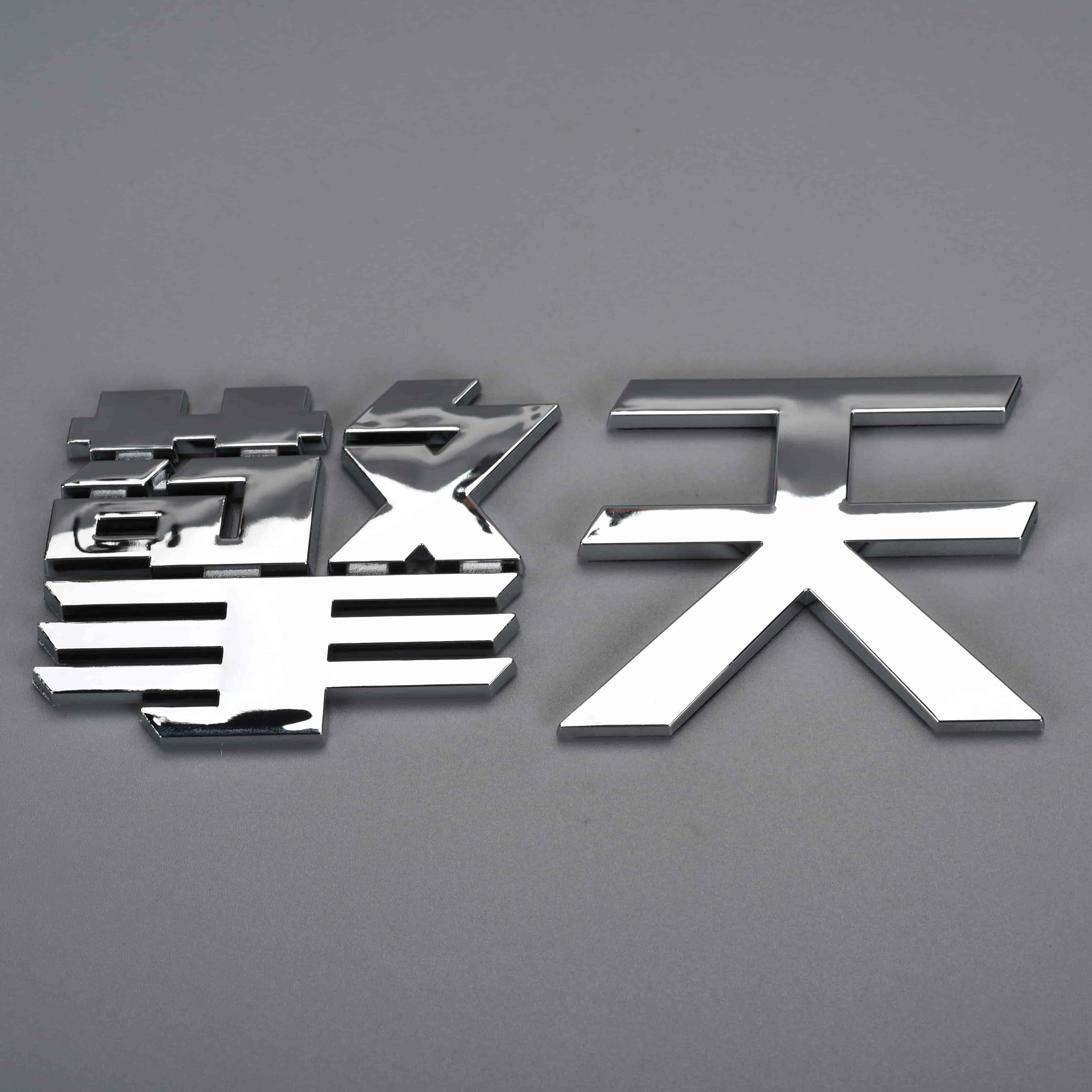 Kunststof merklogo autostickers