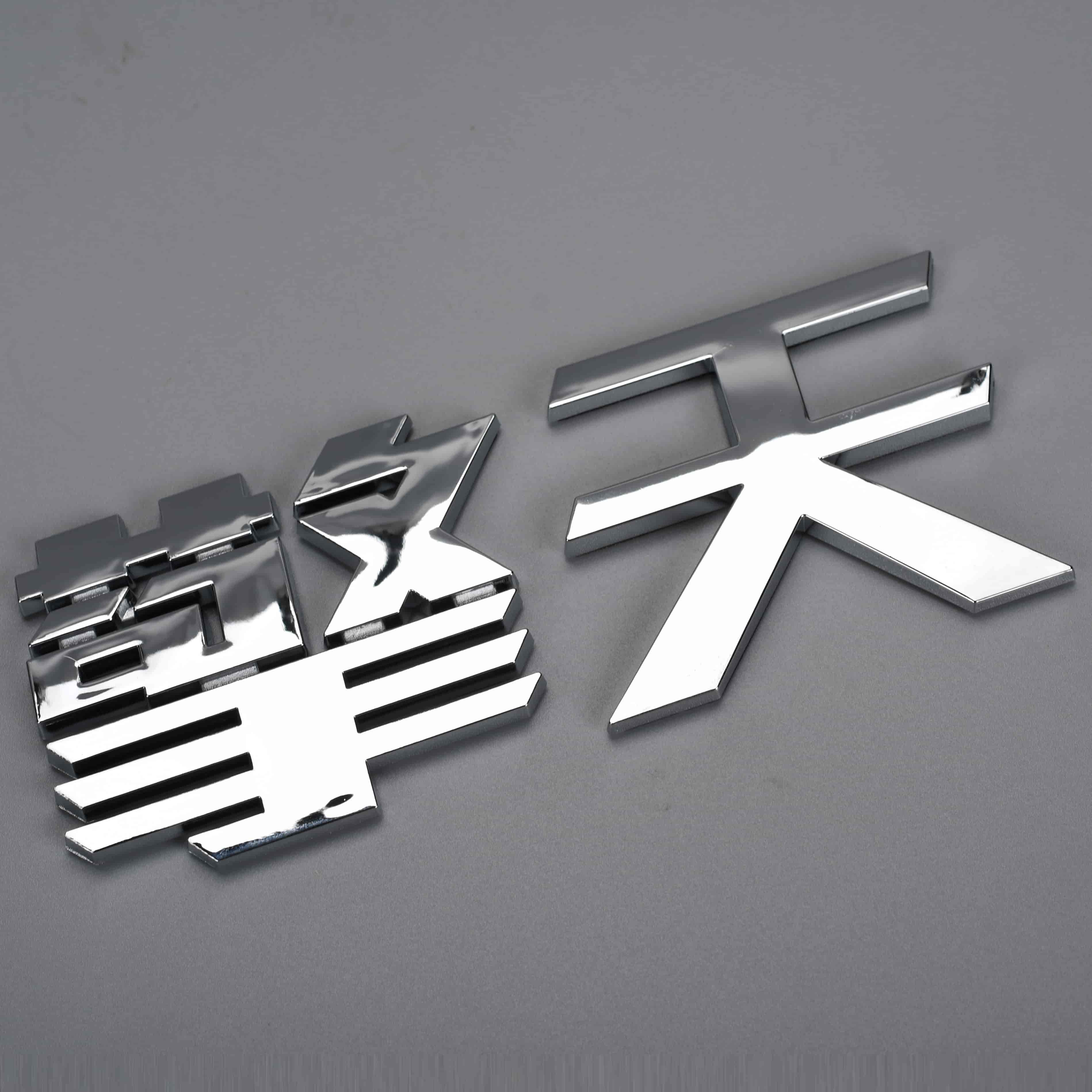 Kunststof merklogo autostickers